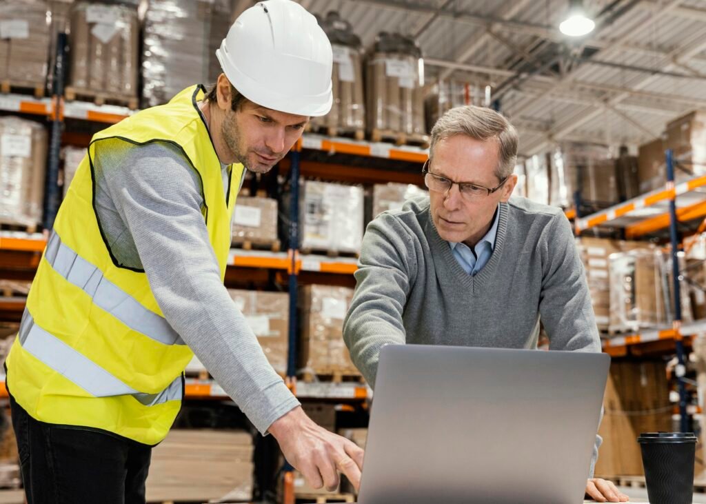 men warehouse working laptop